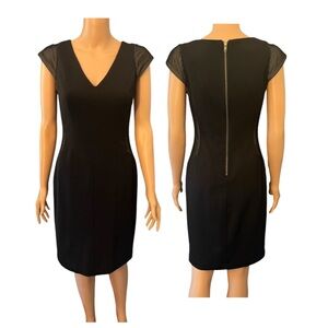 Classy black dress by Maggie London.